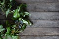 Christmas wreath of holly leaves on a wooden background